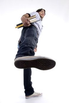 student showing shoe sole on an isolated white background