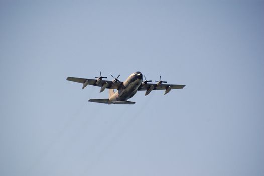 A military plane flying, used normaly as a transport