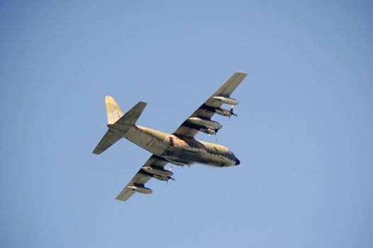 A military plane flying, used normaly as a transport
