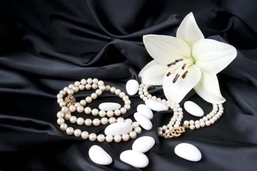 Jewelry and other precious stones on black background fabric