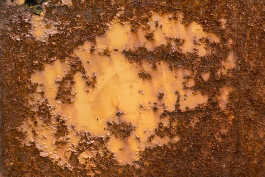 Peeled paint on rusty metal.