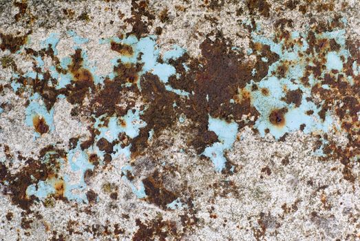 Peeled paint and stains on rusty metal.