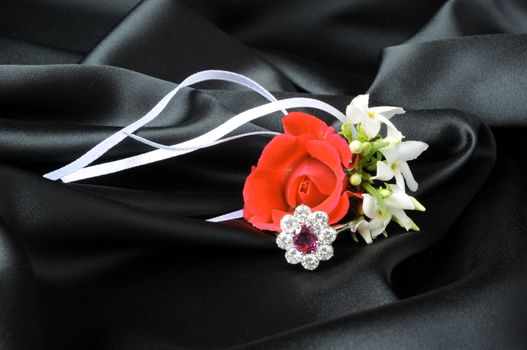 Jewelry and other precious stones on black background fabric