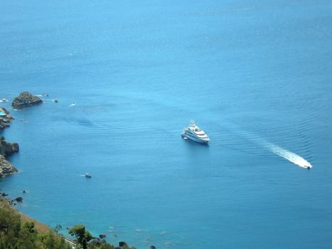 a yacht in front of taormina  