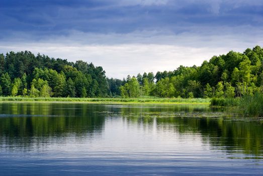 Beautiful lake view - bright interval between rain. Mazury, Poland.