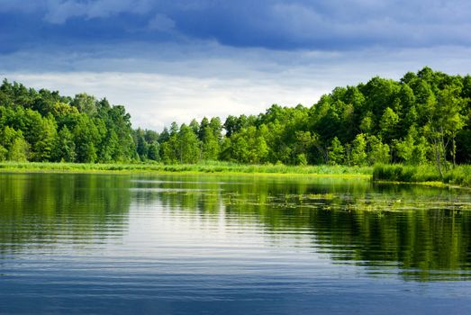 Beautiful lake view - bright interval between rain. Mazury, Poland.