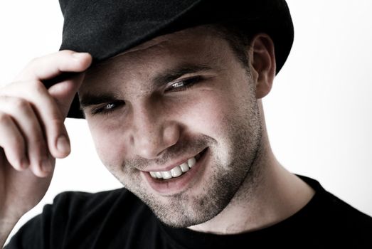 Portrait of young man wearing hat - selective focus on the model's eyes.