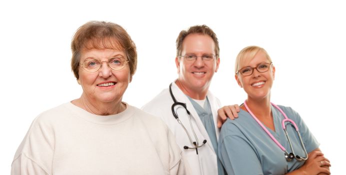 Smiling Senior Woman with Medical Doctor and Nurse Behind Isolated on a White Background.