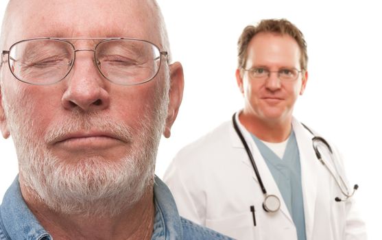Concerned Senior Man with Male Doctor Behind Isolated on a White Background.