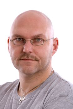 Mature balding man on white background looking serious