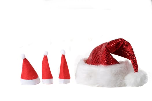 Christmas hats in various sizes on white background