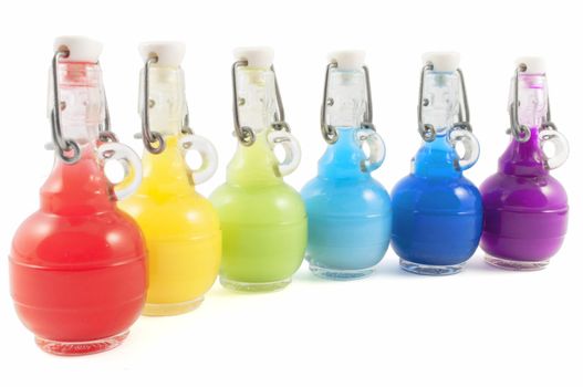 Colorful closed flask disposition, from red to purple