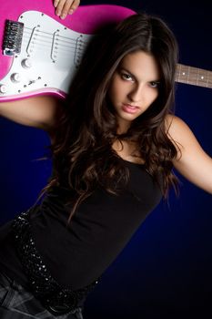 Rockstar girl holding electric guitar