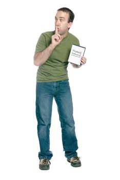 A young man holding a dvd case with pirated computer software in it and telling someone to shhh, isolated against a white background.