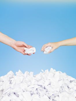 Hands with papers on blue backround