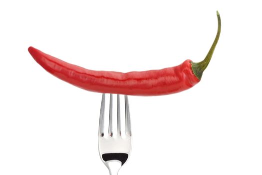 red pepper on a fork isolated on a white background