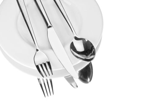 fork, knife and a spoon on a white plate