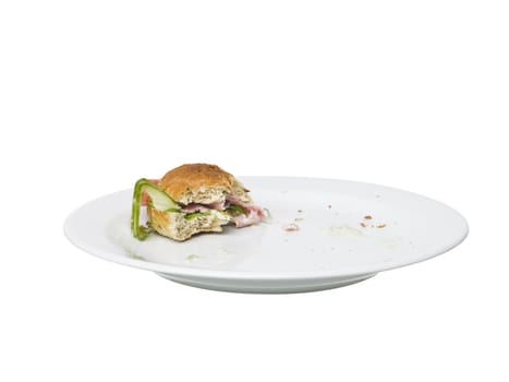 Almost eaten Sandwich on a plate isolated on white background