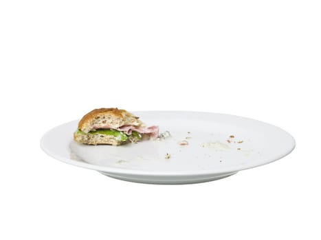 Almost eaten Sandwich on a plate isolated on white background