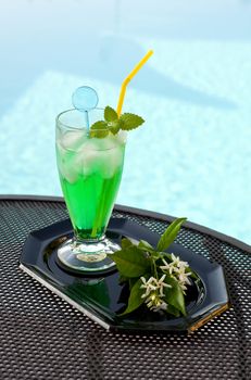 Iced drinks placed on board a private pool.
