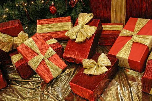 a collection of nicely wrapped gift boxes - red and gold