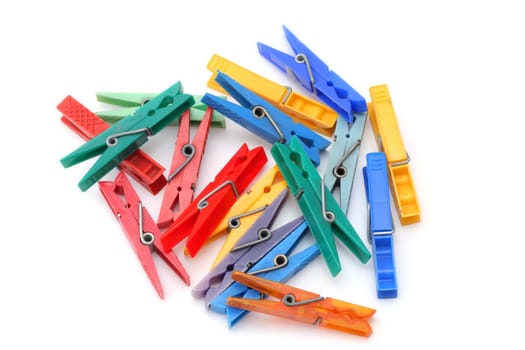 Colorful clothes pegs isolated on white background
