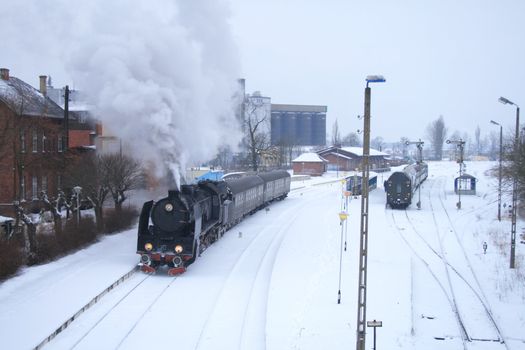 Old retro steam train stopped at the station