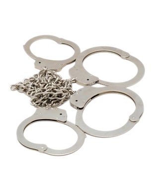 Silver handcuffs isolated over white background