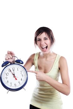 Expressive Young Woman Holding A Big Alarm Clock And Pointing The Time