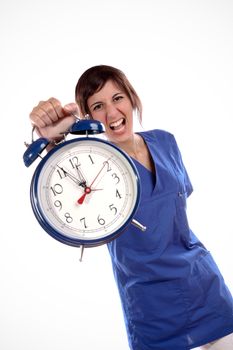 Young Expressful Woman In Blue Uniform Shirt Holding A Big Alarm Clock