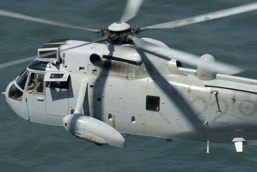 a royal Australian navy rescue helicopter performing a public rescue demonstration for Australia day