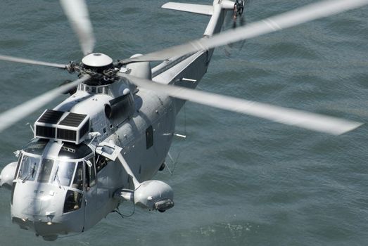 a royal Australian navy rescue helicopter performing a public rescue demonstration for Australia day