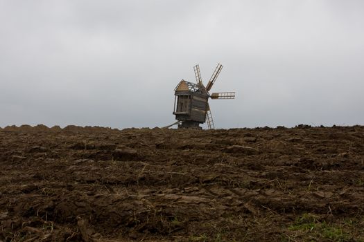 The Mill on the background of the broken ground