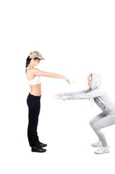 Shoot of two fitness instructors isolated on white