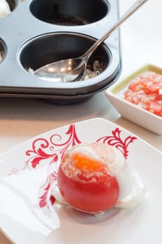 Shot of breakfast - tomato with egg and cupcake shape