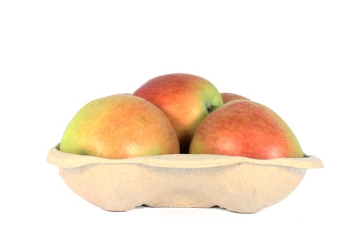 Ripe fresh apple in a karton container, isolated