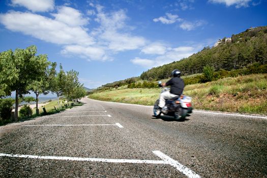 Motorist on the road with mountain scenery