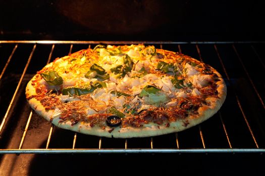 Freshly made pizza in the oven