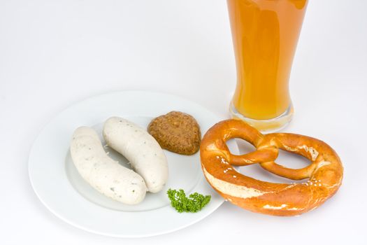 bavarian white sausage, wheat beer and pretzel