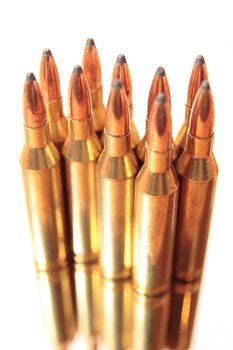 ammunition all in a bunch on a white background