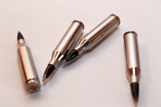 ammunition all in a cluster on a white background