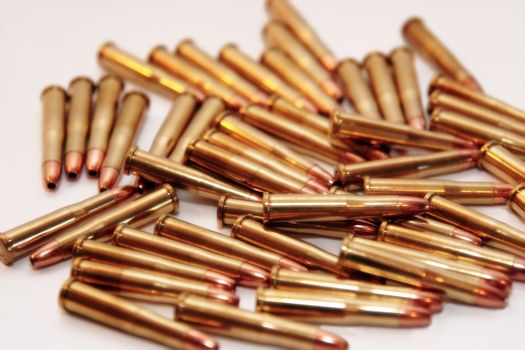 ammunition all in a cluster on a white background