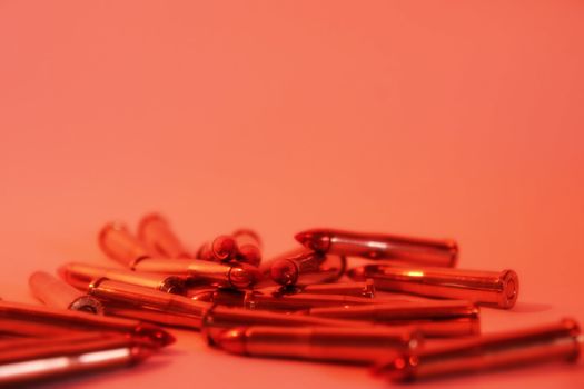 ammunition all in a cluster on a red background