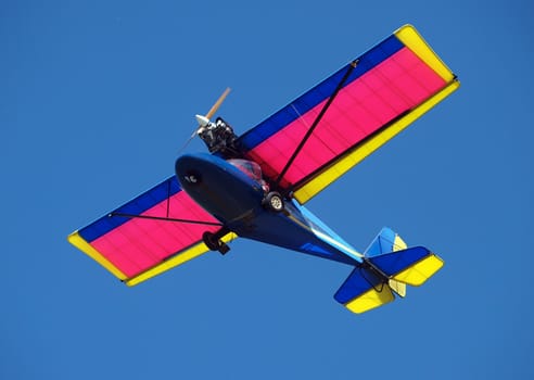 Microlight Aircraft against a blue sky