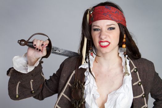 Angry pirate woman holding sword