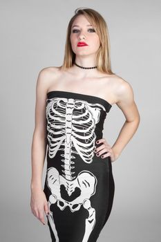 Pretty girl wearing skeleton dress