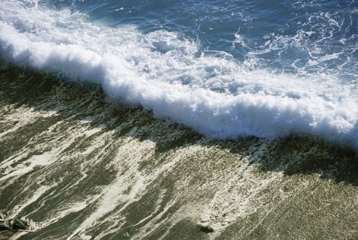 Ocean wave is crashing on the shore