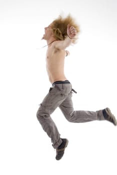 side pose of male jumping in air against white background