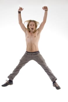 shirtless man jumping high in joy with white background