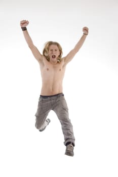 handsome male jumping high in joy against white background